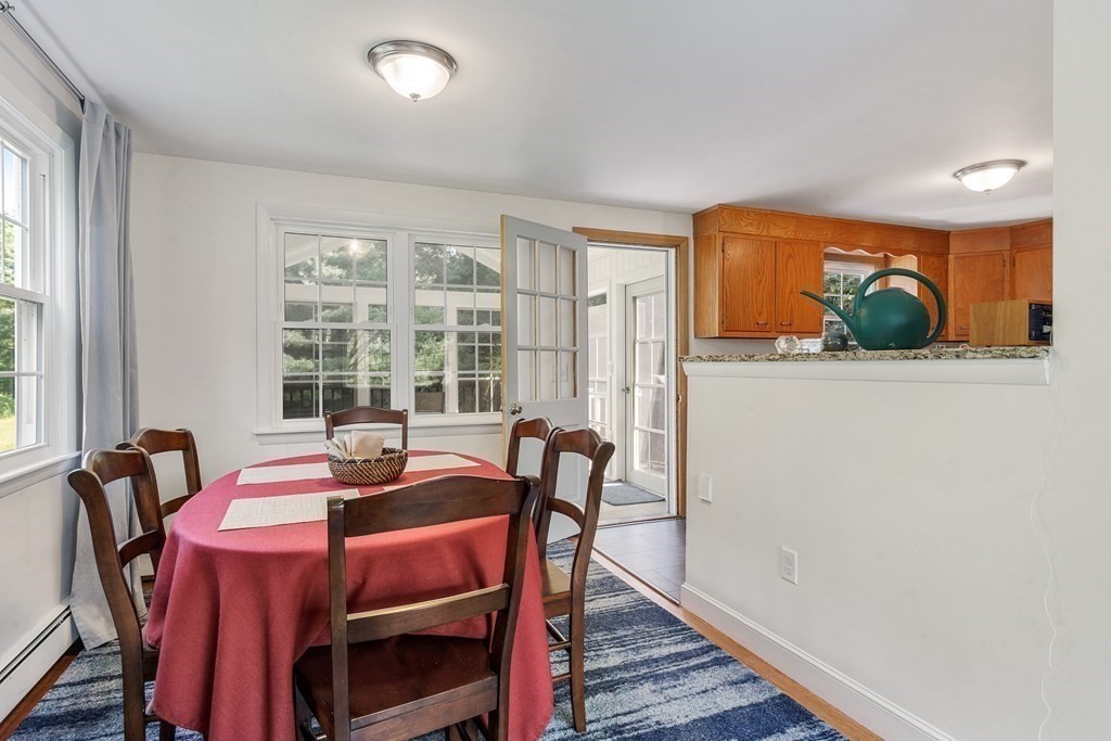 36 Putnam Road Bedford, MA 01730 - Photo 5 of 15 a view of a dining room with furniture and window