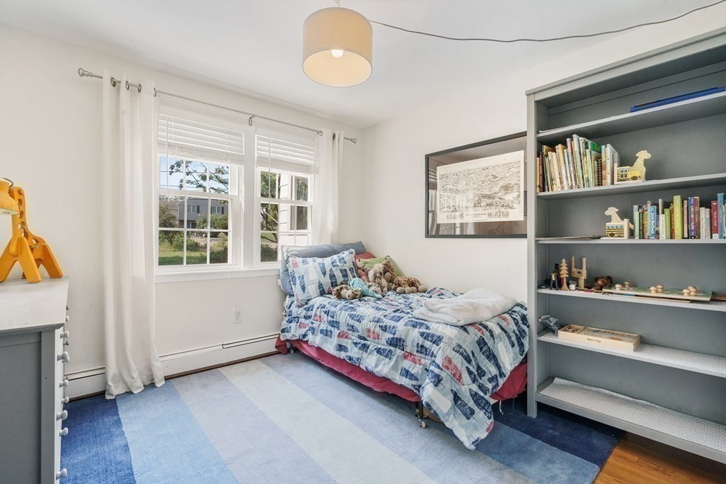 36 Putnam Road Bedford, MA 01730 - Photo 8 of 15 a bedroom with a bed and a window