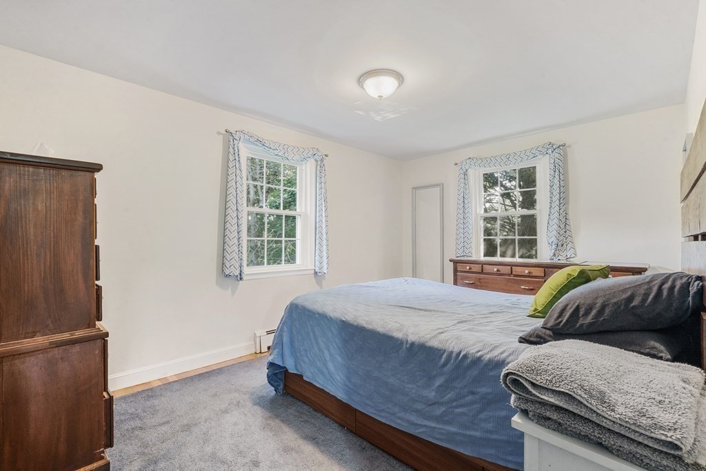 36 Putnam Road Bedford, MA 01730 - Photo 9 of 15 a bedroom with a bed and a window