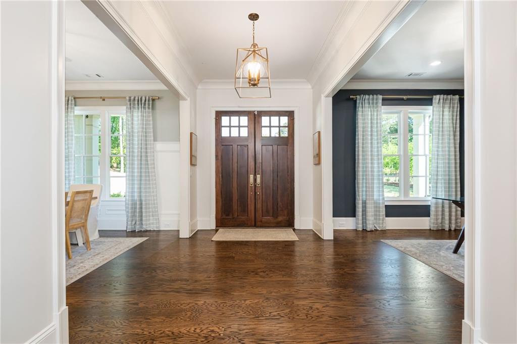 4184 Thompson Mill Road Buford, GA 30519 - Photo 12 of 53 a view of a livingroom with wooden floor and windows