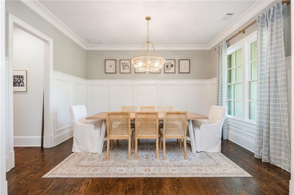 4184 Thompson Mill Road Buford, GA 30519 - Photo 14 of 53 a view of a dining room with furniture window and wooden floor