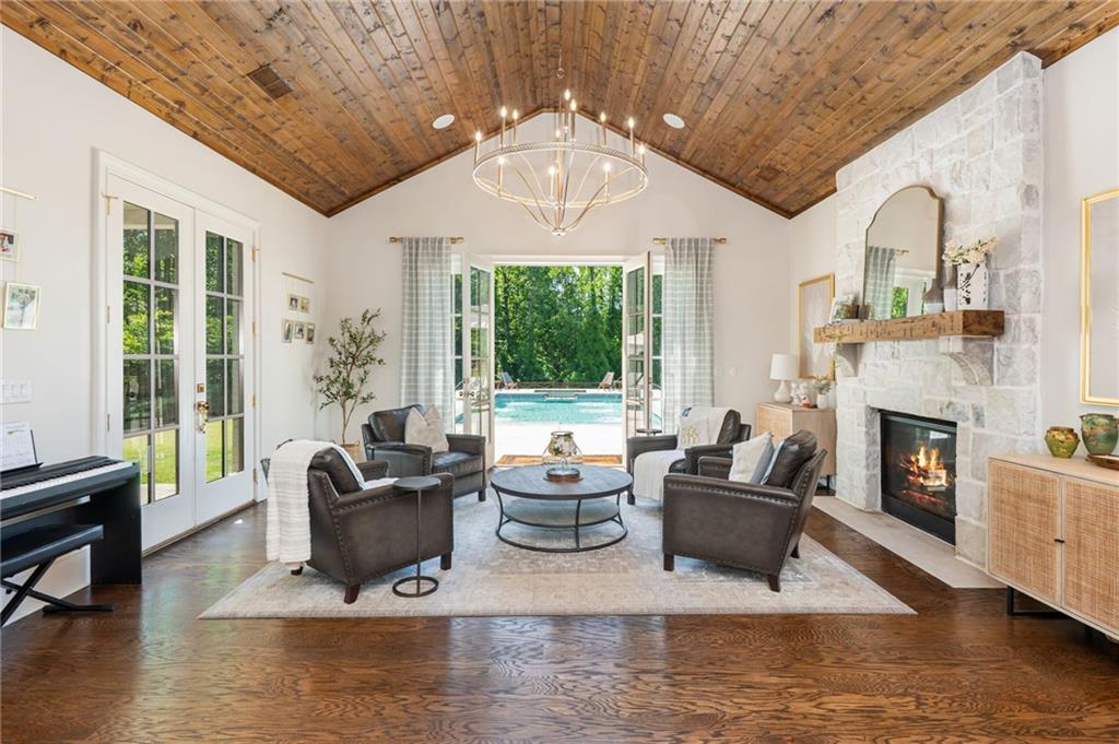 4184 Thompson Mill Road Buford, GA 30519 - Photo 2 of 53 a living room with fireplace furniture and a large window