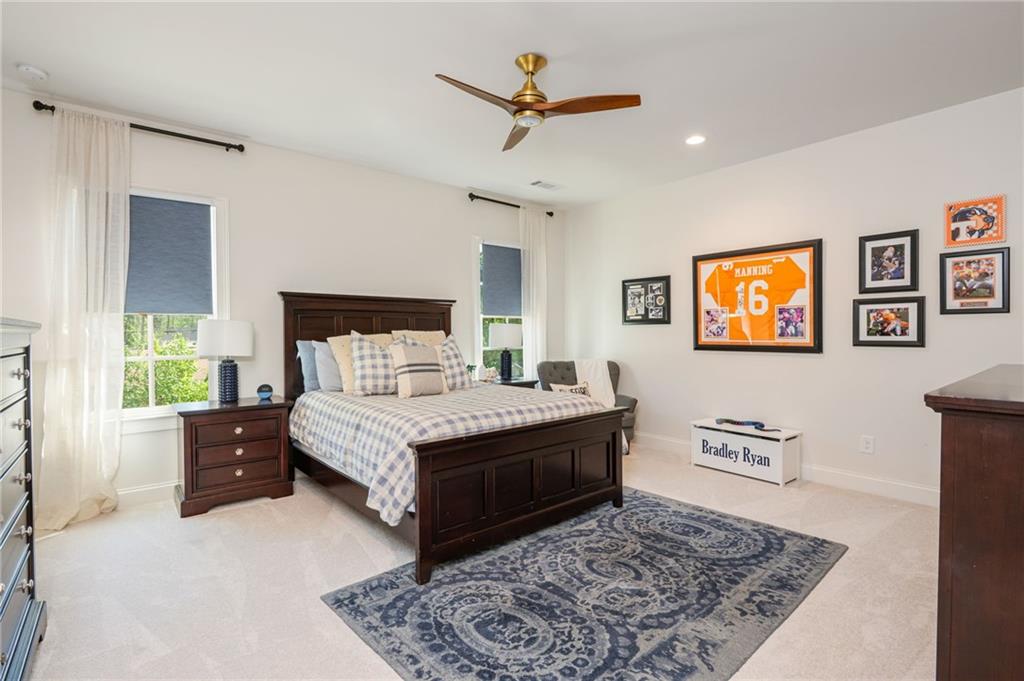 4184 Thompson Mill Road Buford, GA 30519 - Photo 36 of 53 a bedroom with a bed rug and window