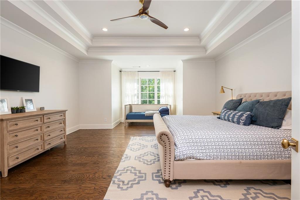 4184 Thompson Mill Road Buford, GA 30519 - Photo 40 of 53 a bedroom with a large bed and a flat screen tv