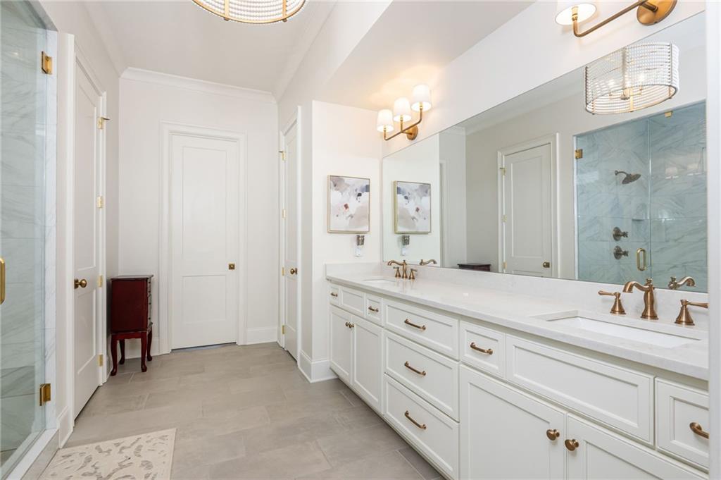 4184 Thompson Mill Road Buford, GA 30519 - Photo 42 of 53 a bathroom with a granite countertop sink mirror and double