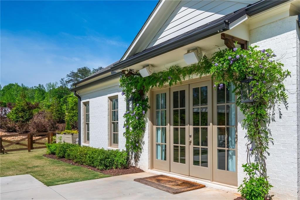 4184 Thompson Mill Road Buford, GA 30519 - Photo 48 of 53 a view of front door and potted plants
