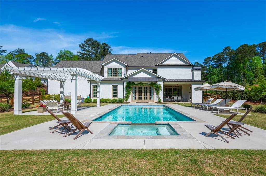 4184 Thompson Mill Road Buford, GA 30519 - Photo 5 of 53 a view of a house with swimming pool