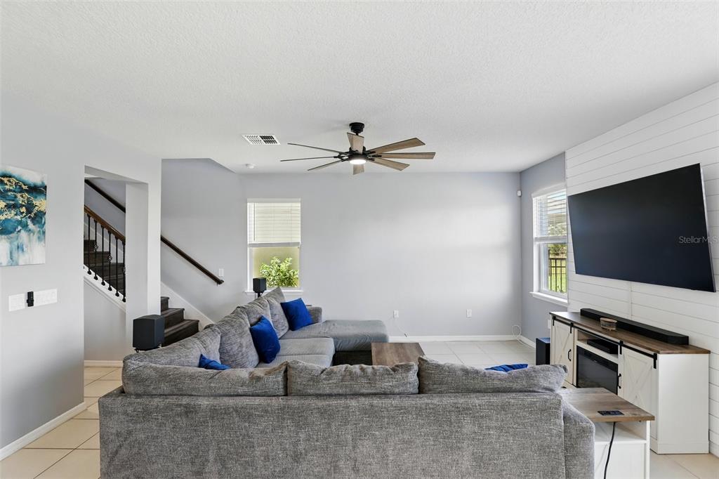 1338 Riley Circle Deland, FL 32724 - Photo 11 of 39 a living room with furniture and a flat screen tv