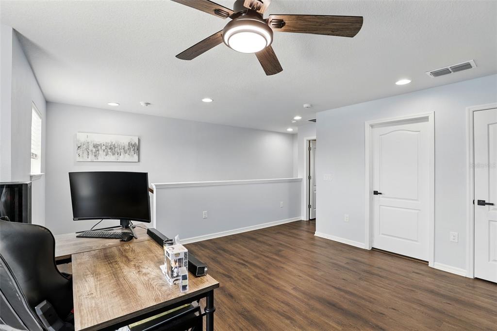 1338 Riley Circle Deland, FL 32724 - Photo 13 of 39 a room with furniture and flat screen tv