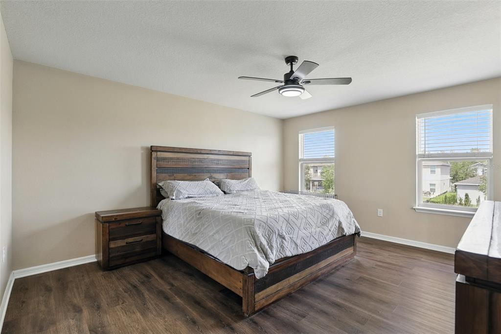 1338 Riley Circle Deland, FL 32724 - Photo 16 of 39 a bedroom with a bed and a ceiling fan