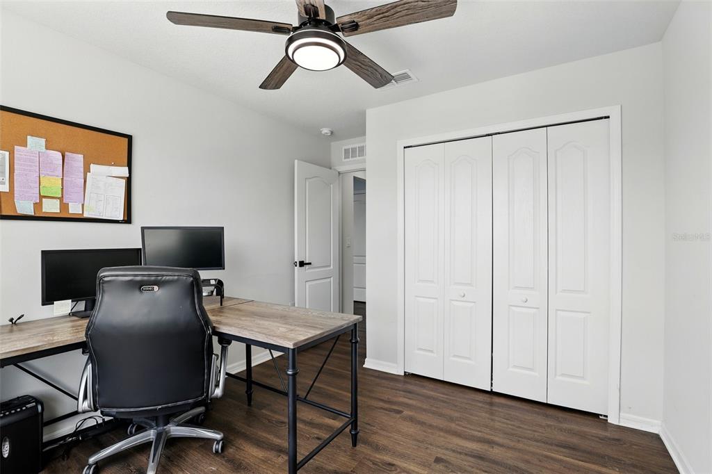 1338 Riley Circle Deland, FL 32724 - Photo 22 of 39 a workspace with furniture and wooden floor