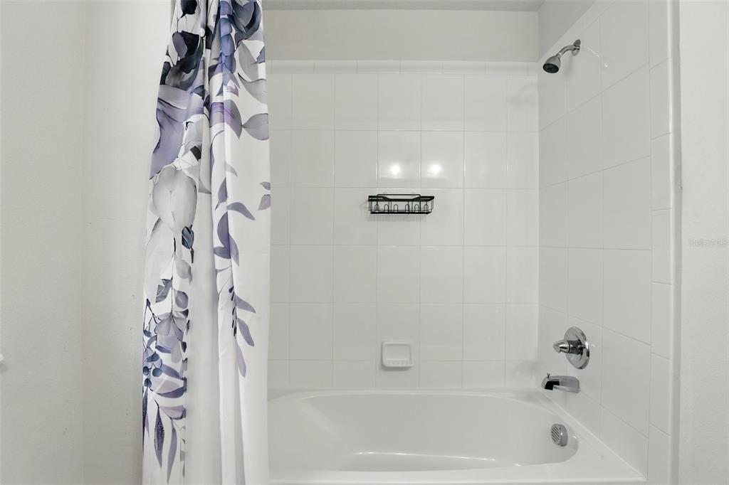 1338 Riley Circle Deland, FL 32724 - Photo 24 of 39 a bathroom with a bathtub and shower