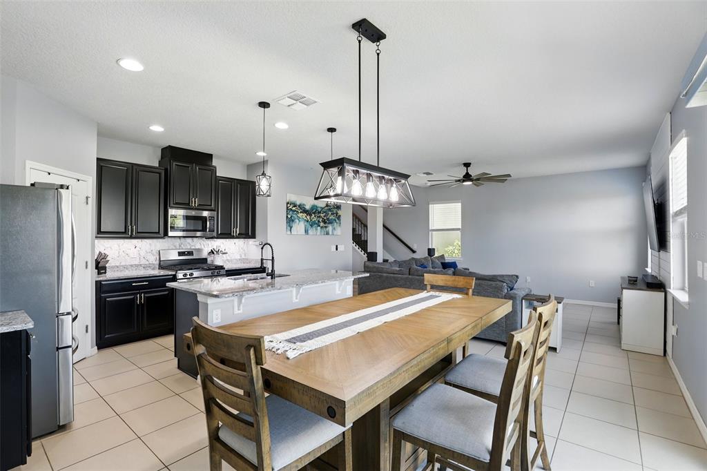 1338 Riley Circle Deland, FL 32724 - Photo 9 of 39 a view of a dining room kitchen and a chandelier