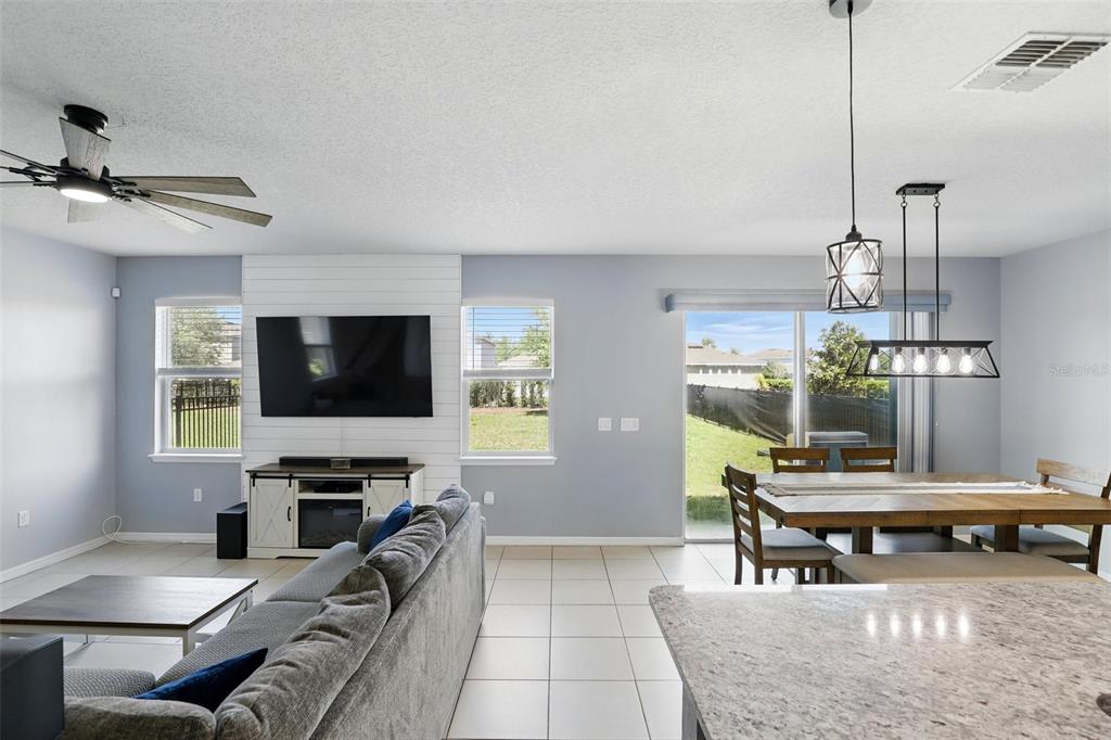 1338 Riley Circle Deland, FL 32724 - Photo 10 of 39 a living room with furniture and a flat screen tv