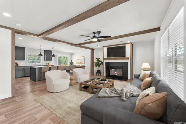 a living room with furniture and a fireplace