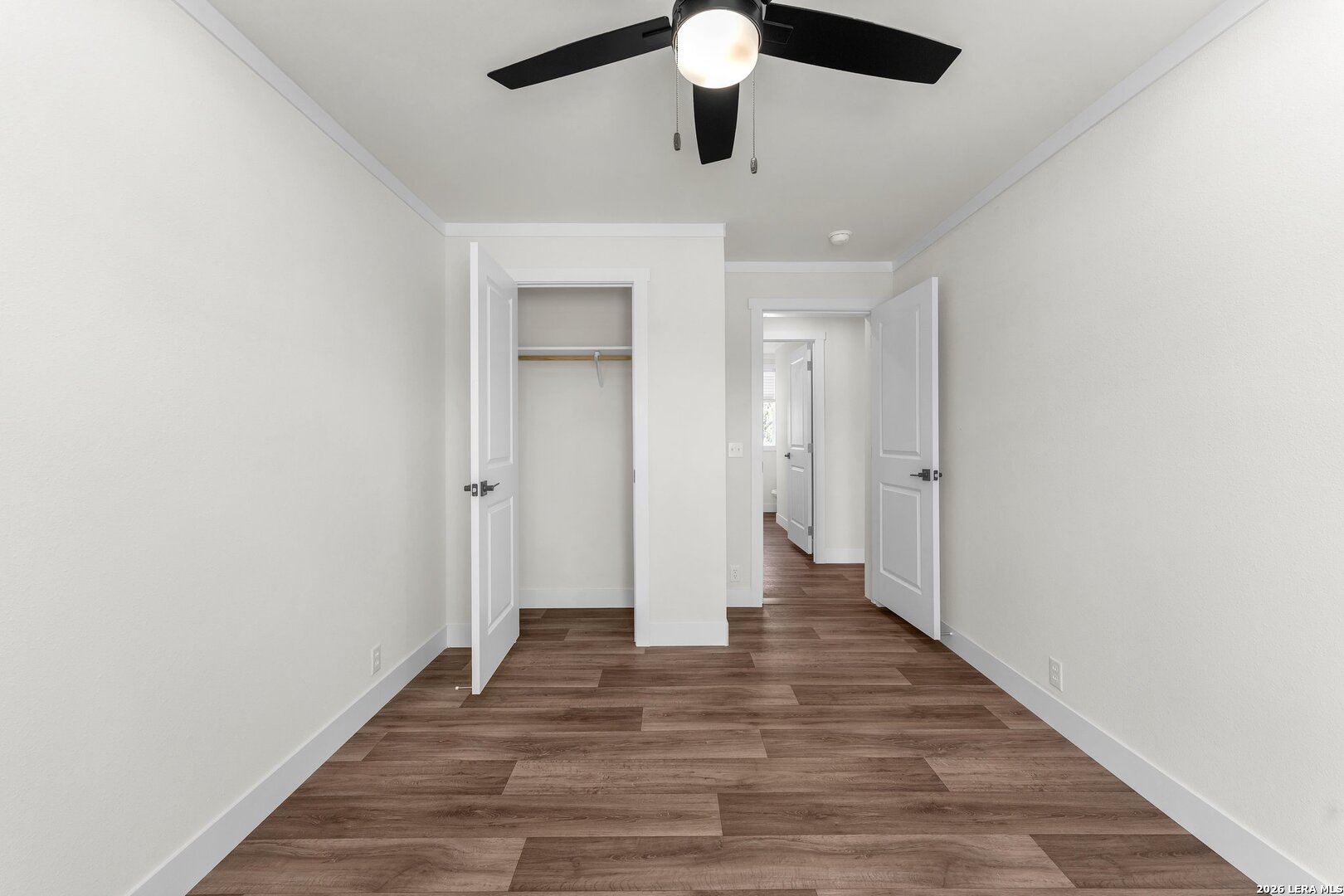 2218 Stevens Road Somerset, TX 78069 - Photo 20 of 24 a view of an empty room with wooden floor