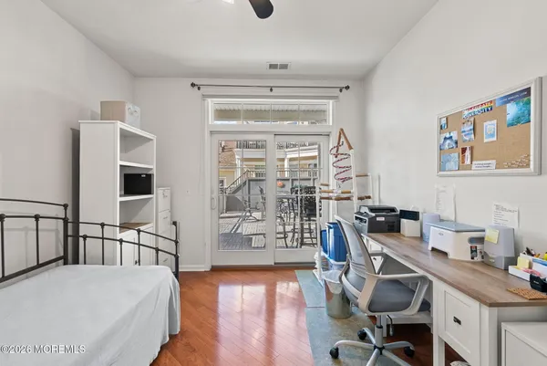 a workspace with furniture hardwood and a window