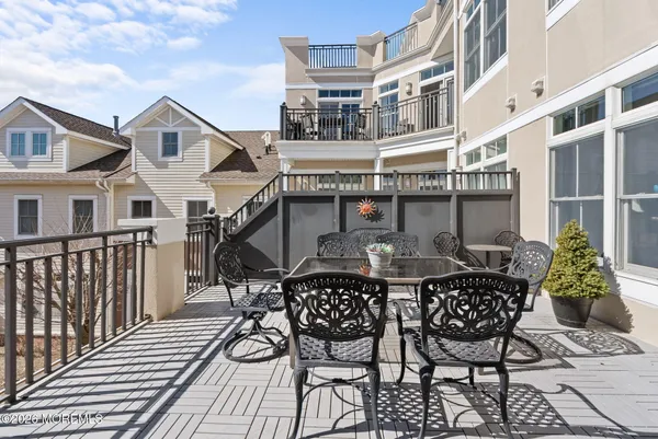 a view of a chairs and table on the terrace