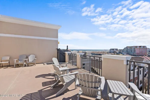 a view of a terrace with furniture