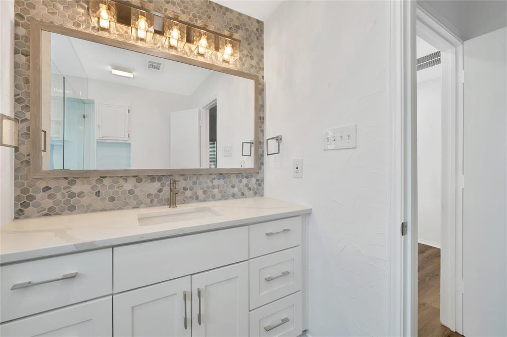 2909 Normandy Court Euless, TX 76039 - Photo 30 of 36 a bathroom with a sink and a mirror