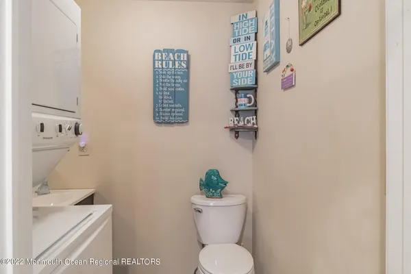 a white toilet sitting next to a bathroom sink
