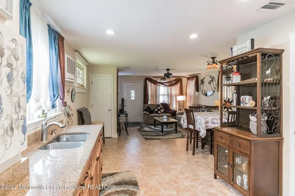 a very nice looking living room with furniture and a large window
