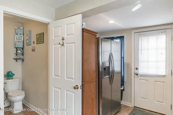 a bathroom with a shower toilet and sink