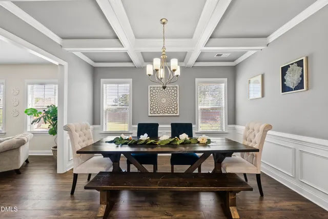 a kitchen with kitchen island a sink and a refrigerator