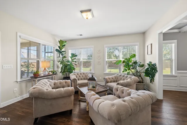 a view of a dining room with furniture wooden floor and chandelier
