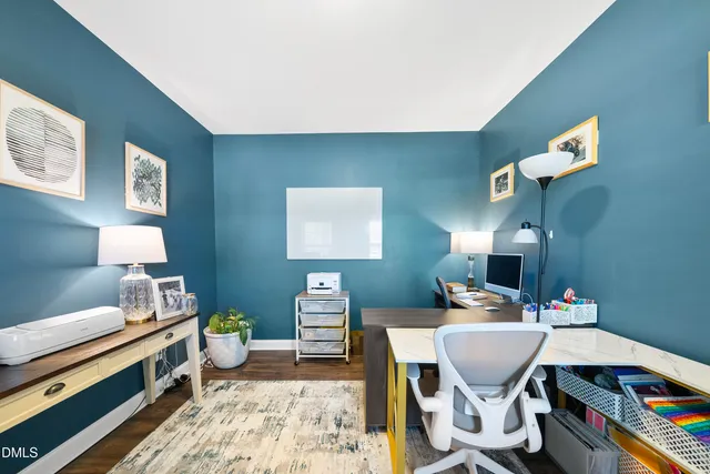 a bathroom with a toilet and a sink a mirror