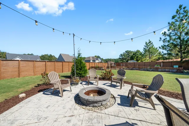 a view of a swimming pool and lounge chairs