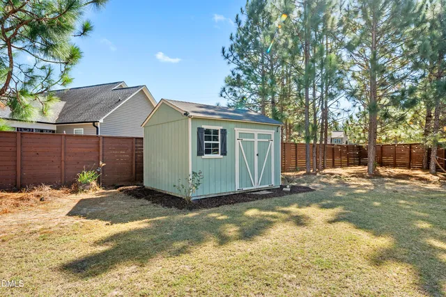 a patio with a yard table and chairs