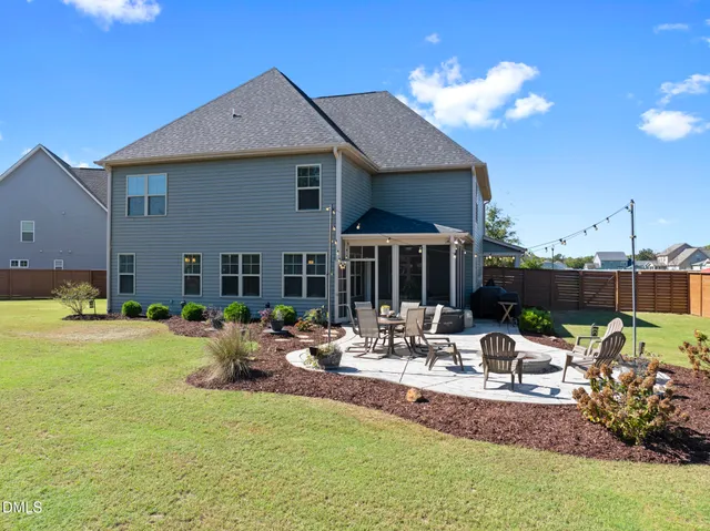 a view of a house with a yard porch and sitting area