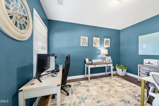 a picture of a bench in front of a building