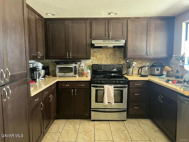 a kitchen with a cabinets and appliances