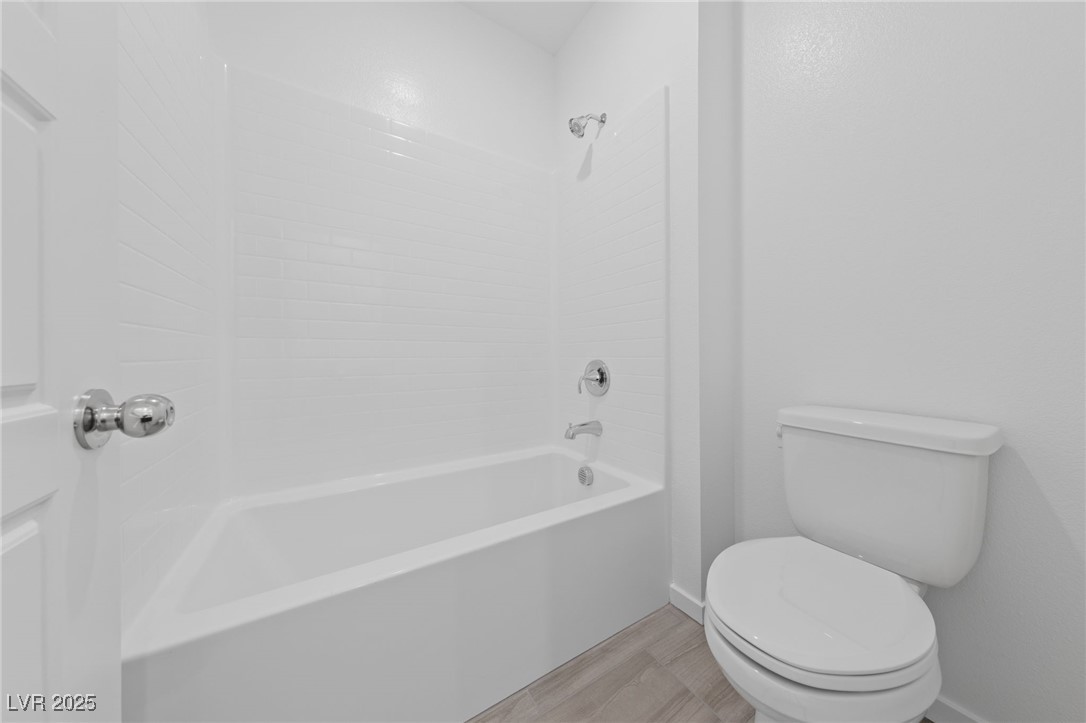 1561 Layla Crossing Avenue Henderson, NV 89002 - Photo 16 of 31 Full bath featuring shower combination and light wood-style floors