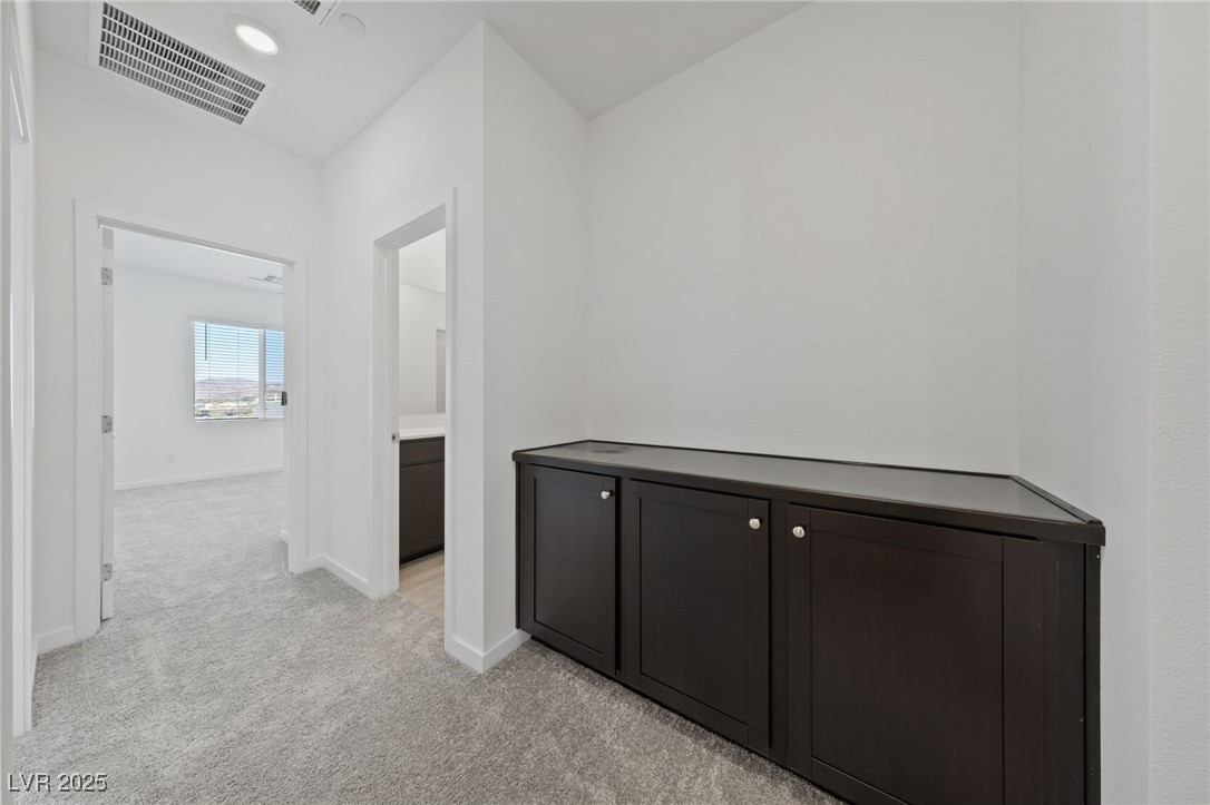 1561 Layla Crossing Avenue Henderson, NV 89002 - Photo 22 of 31 Corridor featuring light carpet and recessed lighting