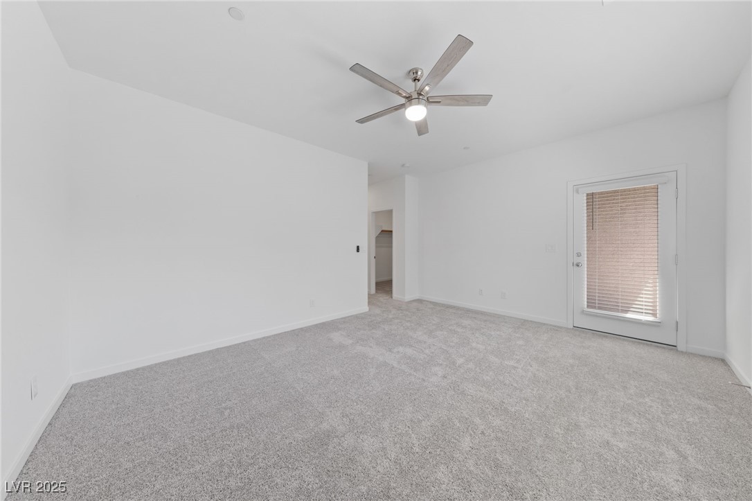 1561 Layla Crossing Avenue Henderson, NV 89002 - Photo 25 of 31 Unfurnished room with light carpet and a ceiling fan