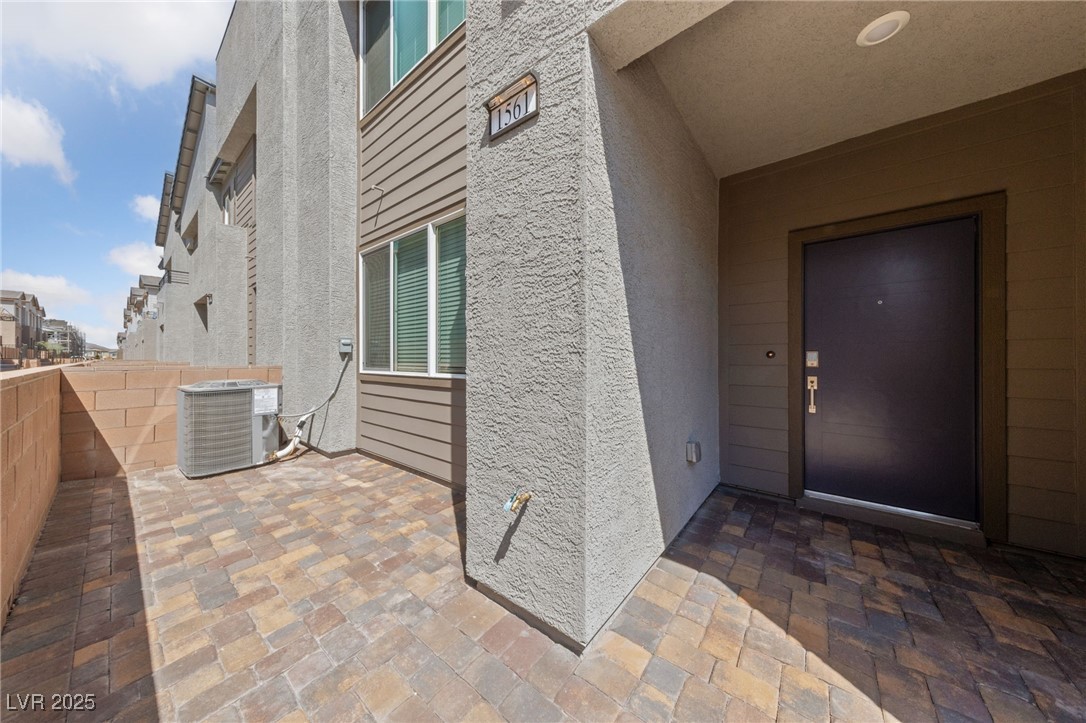 1561 Layla Crossing Avenue Henderson, NV 89002 - Photo 3 of 31 Property entrance featuring stucco siding