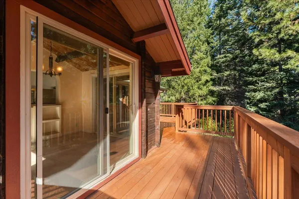 a balcony with wooden floor