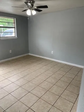 a view of an empty room and window