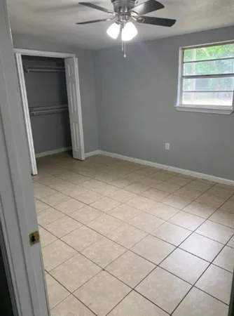 en empty room with window and stairs