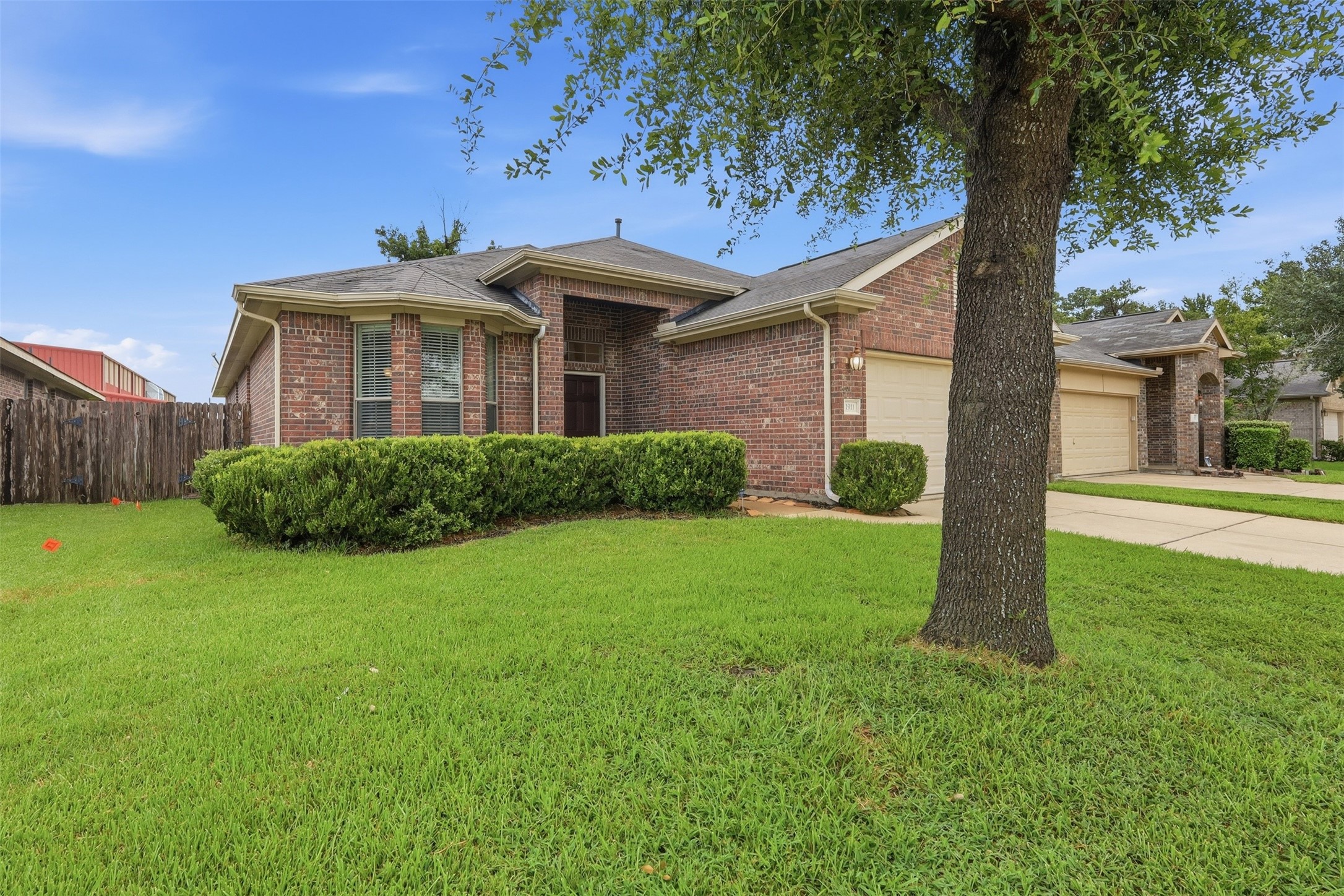 1911 Vale Brook Drive Spring, TX 77373 - Photo 2 of 27 Situated on a spacious lot, this well-maintained home offers an inviting exterior with timeless appeal.