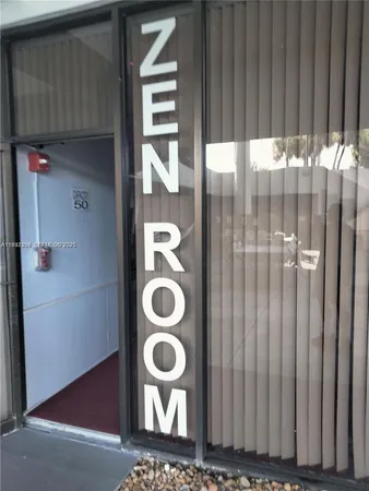 a bathroom with a window and a shower