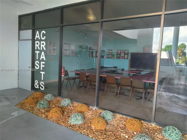 a workspace with furniture and window