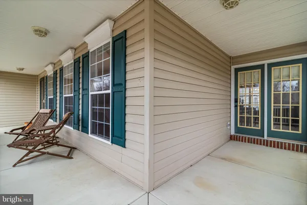 a view of a porch with seating space
