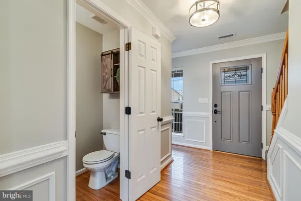 a white toilet sitting next to a bathroom sink