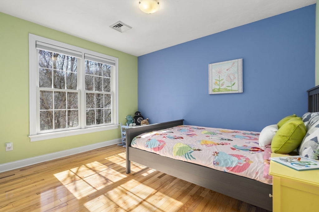 8 Brookside Lane, Unit 8 Northborough, MA 01532 - Photo 15 of 24 a bedroom with a bed and a window