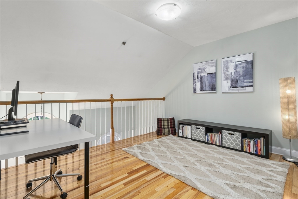 8 Brookside Lane, Unit 8 Northborough, MA 01532 - Photo 17 of 24 a view of a living room and workspace