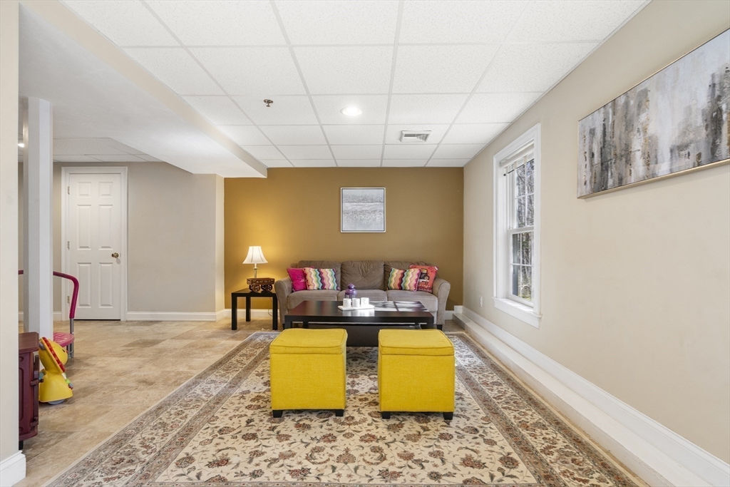 8 Brookside Lane, Unit 8 Northborough, MA 01532 - Photo 19 of 24 a living room with furniture pool table and a window